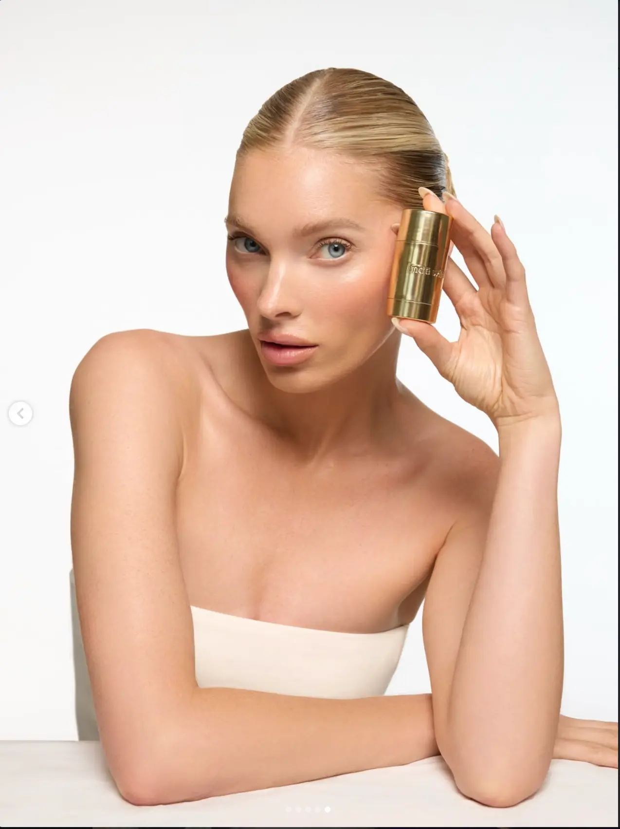 Beauty portrait with product on a clean set