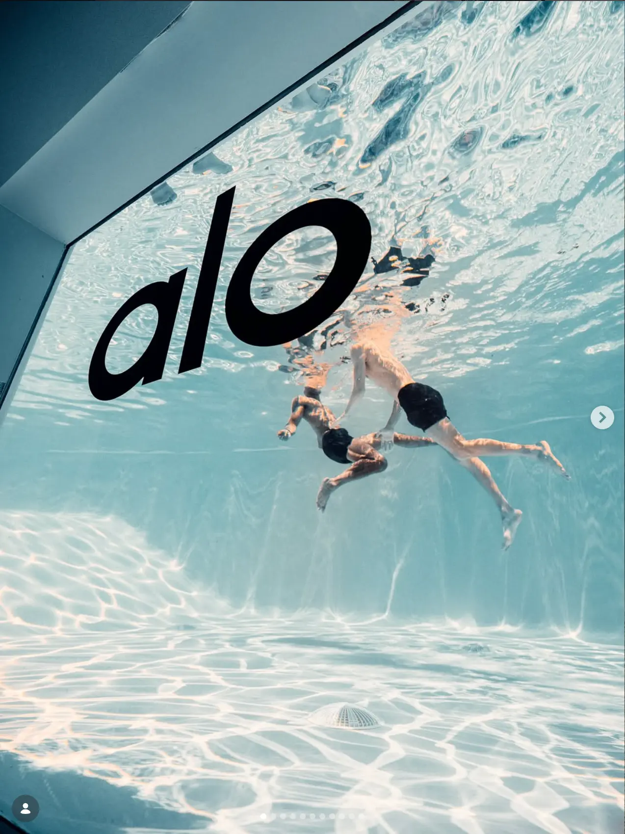 Underwater swim frame beside a graphic wall