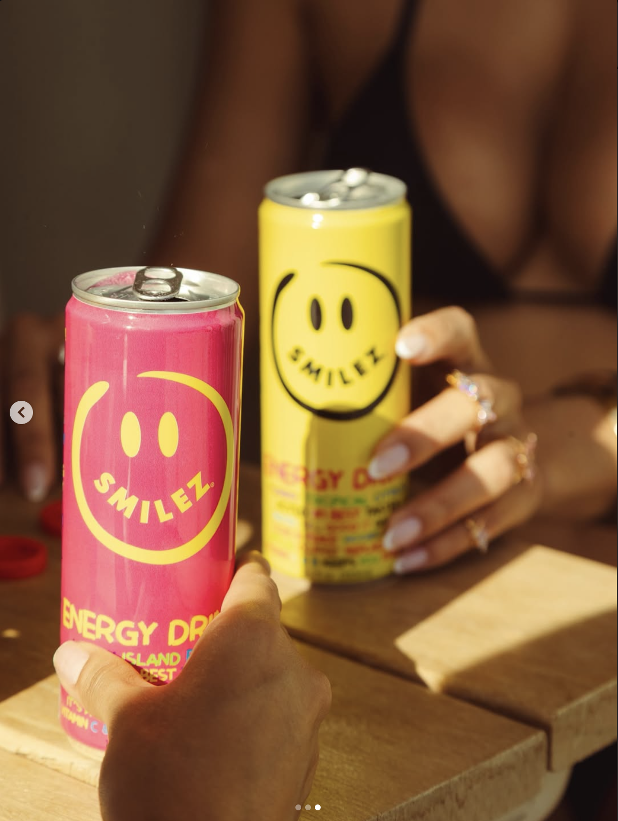 Beverage can held in warm afternoon light